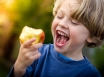 Child eating healthy food after cancer treatment